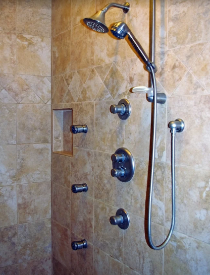 Tiled shower with handheld showerhead and body spray fittings